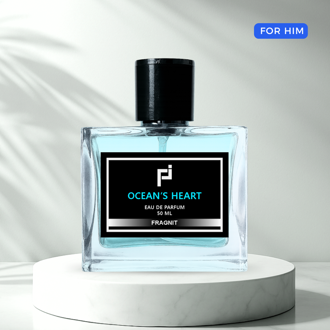 Ocean’s Heart by Fragnit – Fresh Woody Men’s Perfume Bottle with Blue Marine Background