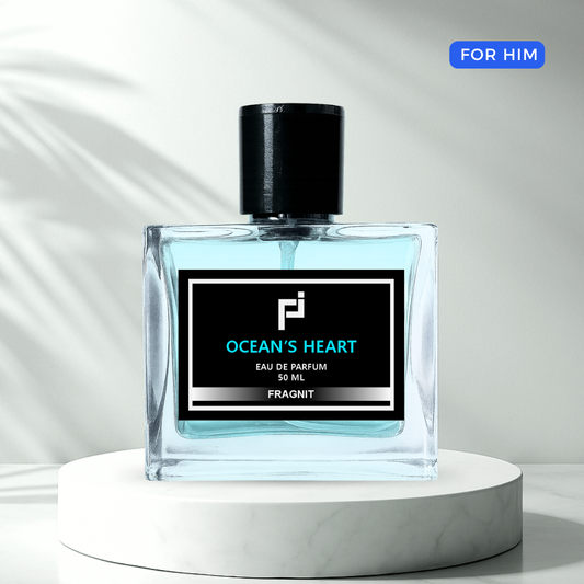 Ocean’s Heart by Fragnit – Fresh Woody Men’s Perfume Bottle with Blue Marine Background
