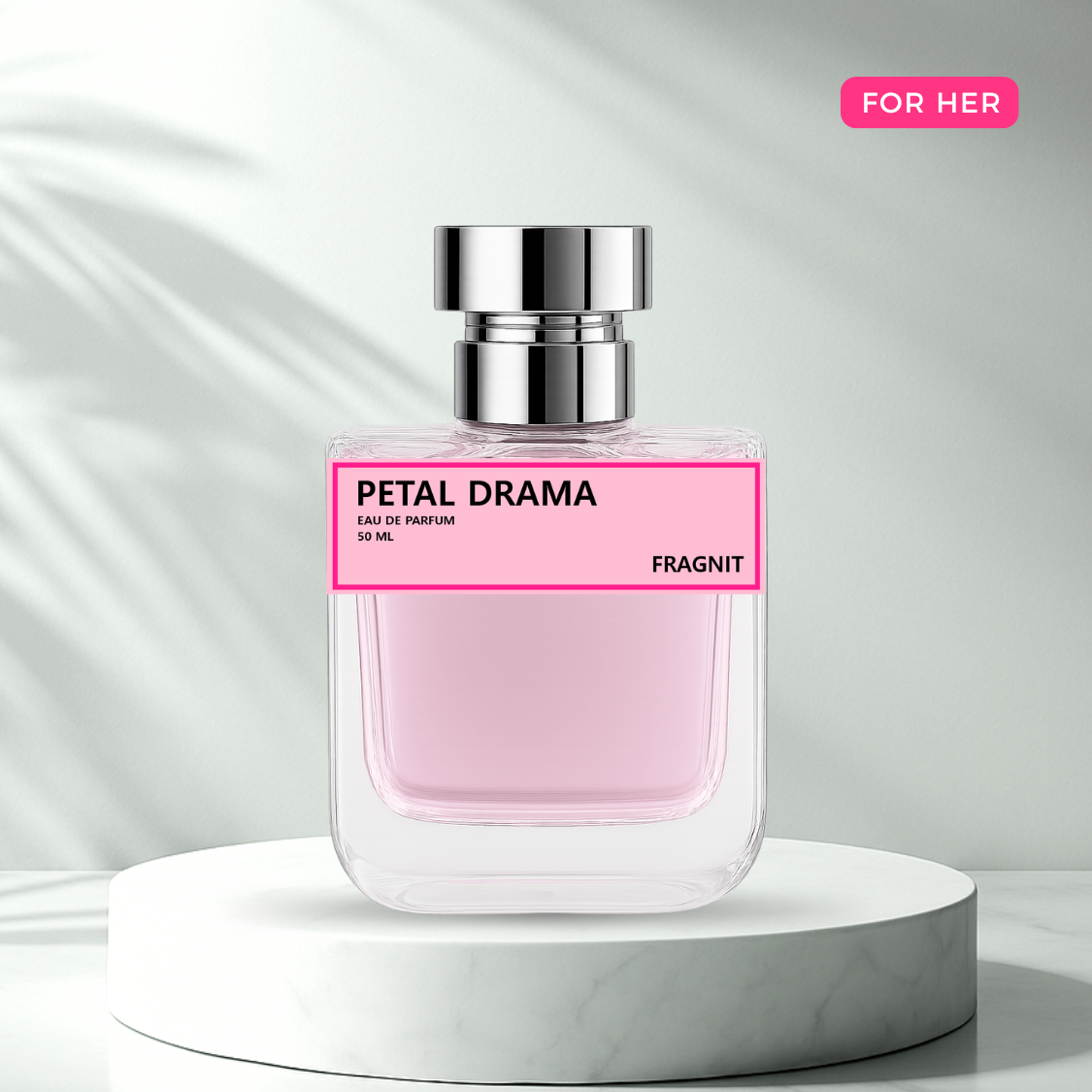 Petal Drama by Fragnit – Floral Fruity Women’s Perfume Bottle with Elegant Pink Background